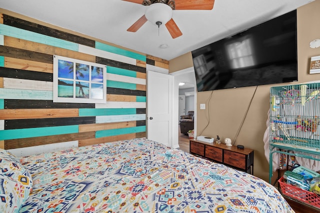 bedroom with ceiling fan and wood-type flooring