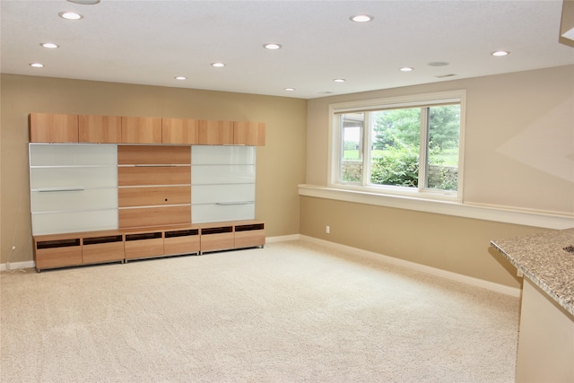 unfurnished bedroom featuring light colored carpet