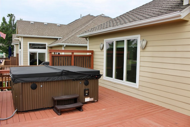 deck featuring a hot tub