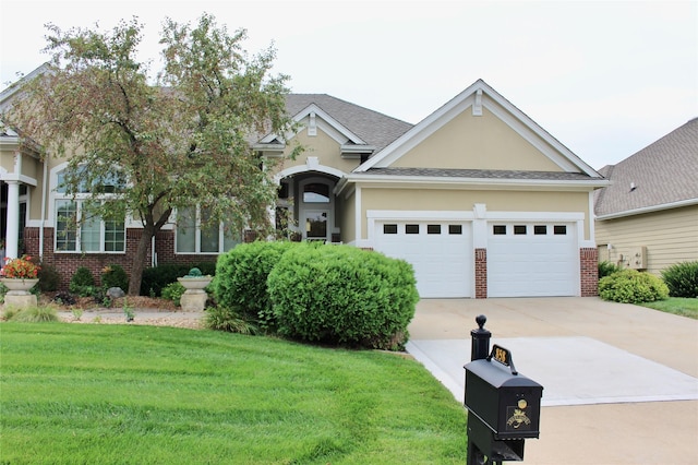 view of front of house featuring a garage, brick siding, concrete driveway, a front lawn, and stucco siding