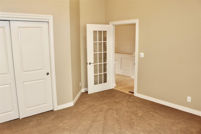 empty room with light colored carpet