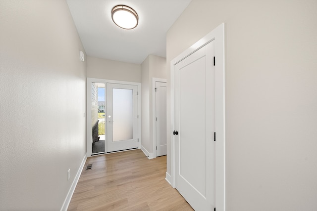 entryway with light hardwood / wood-style flooring