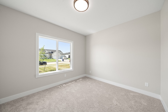 empty room featuring carpet flooring