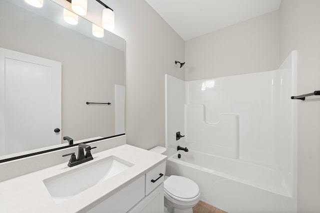 full bathroom with shower / bathing tub combination, vanity, and toilet