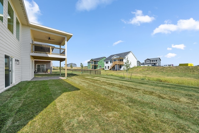 view of yard with a balcony