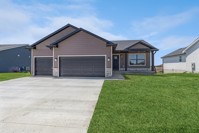 view of front facade featuring a garage and a front lawn