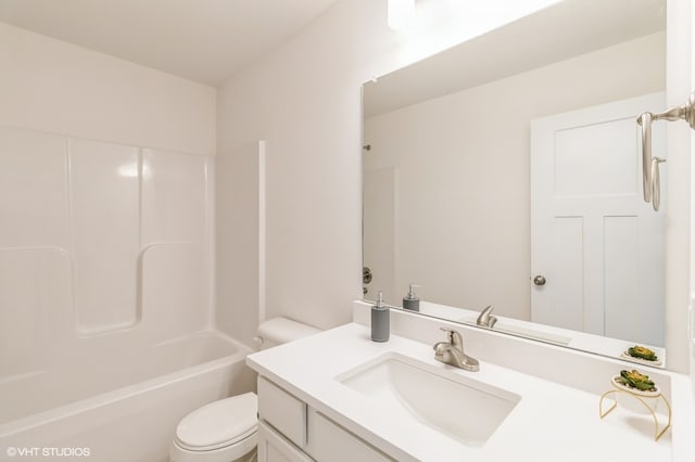 full bathroom featuring shower / bathtub combination, vanity, and toilet