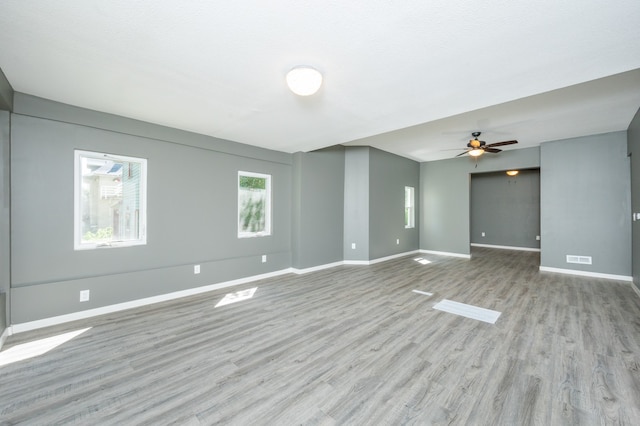 spare room featuring ceiling fan and light wood-type flooring