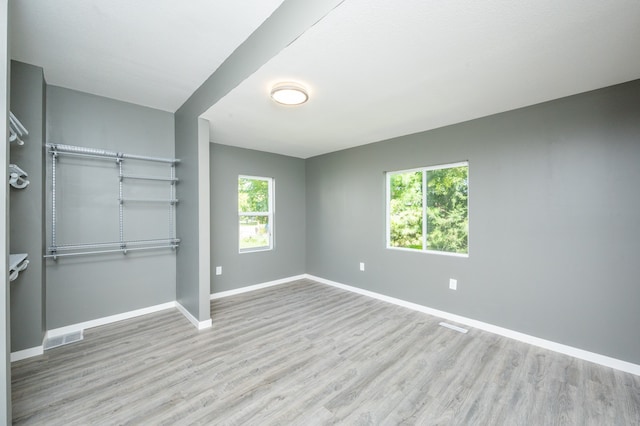 empty room with light wood-type flooring