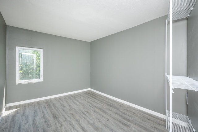 spare room with light hardwood / wood-style floors