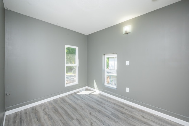 unfurnished room with light hardwood / wood-style floors