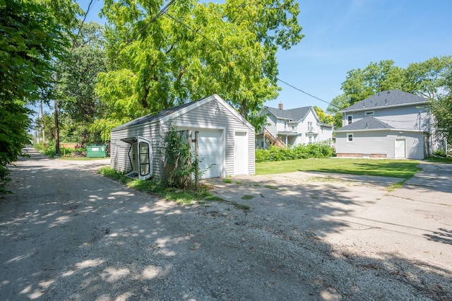 garage featuring a yard