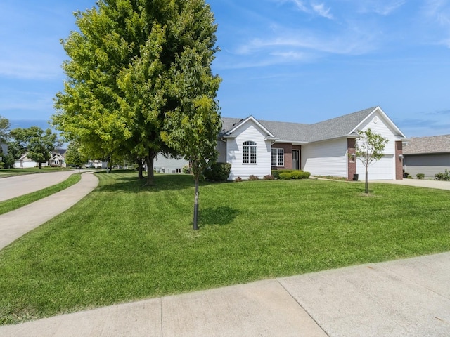 view of front of home featuring a garage and a front lawn