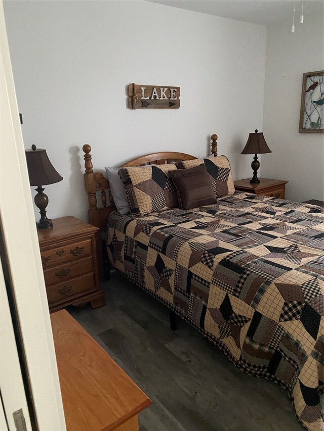 bedroom featuring wood finished floors