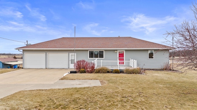 single story home featuring a garage and a front lawn