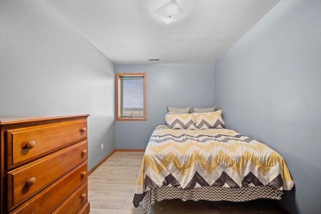 bedroom with light wood-type flooring