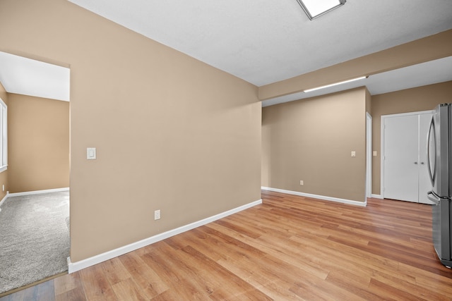 empty room with light wood-type flooring