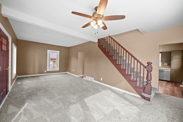 interior space featuring ceiling fan and carpet flooring