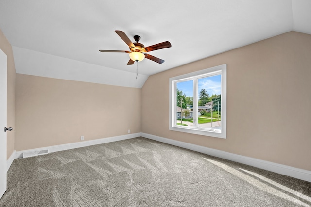 bonus room featuring ceiling fan, vaulted ceiling, and carpet