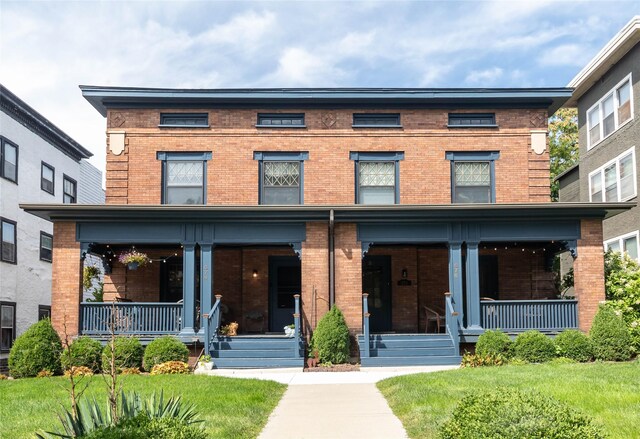 view of front of house with a front lawn and a porch