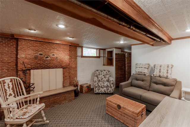 living room featuring carpet floors, crown molding, and brick wall