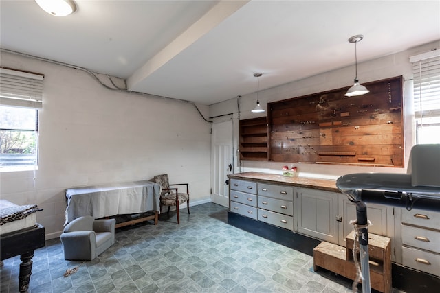 kitchen with tile patterned flooring and hanging light fixtures