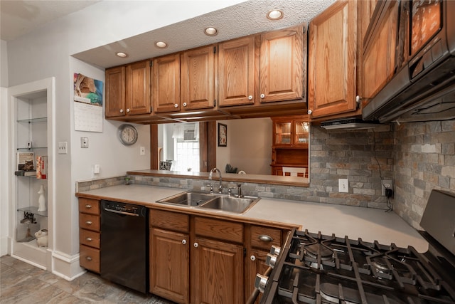 kitchen featuring tasteful backsplash, sink, a textured ceiling, light tile patterned floors, and black dishwasher