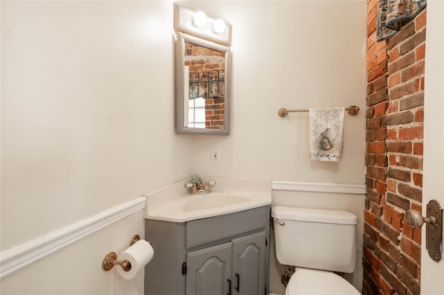 bathroom with toilet and vanity