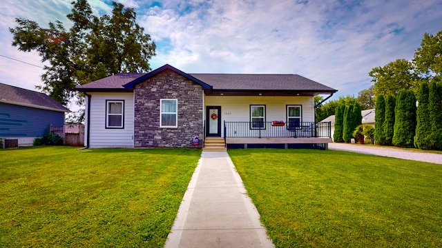 bungalow featuring a front yard and covered porch