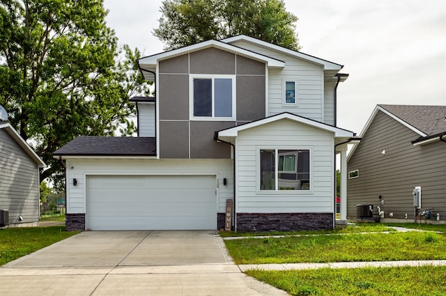 view of front facade with a garage and a front yard