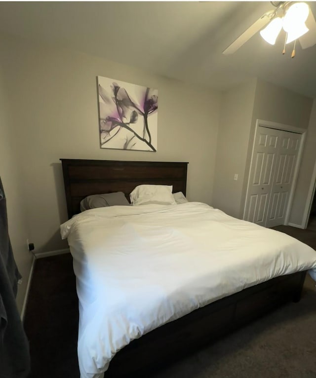 bedroom with a closet, ceiling fan, and baseboards