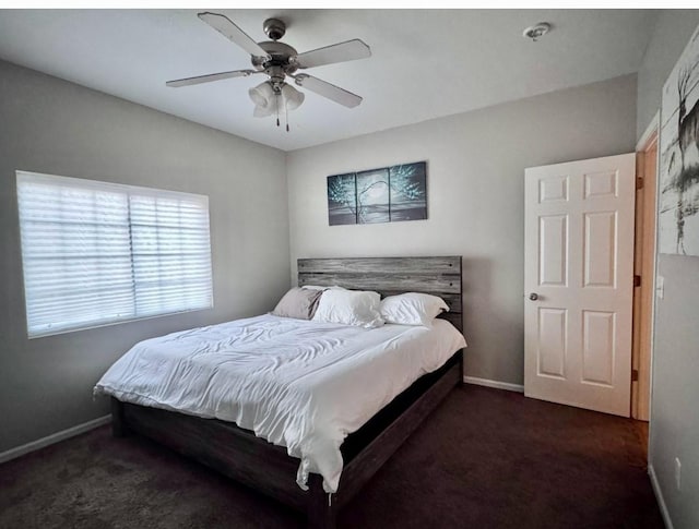 bedroom with carpet floors, a ceiling fan, and baseboards