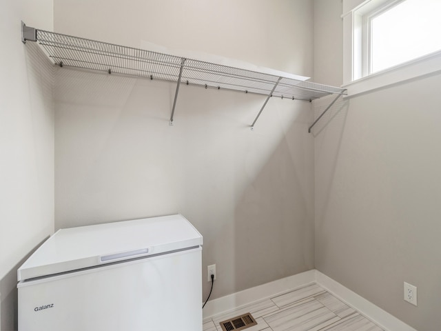 walk in closet featuring light tile patterned floors