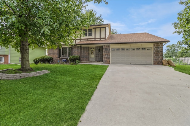 view of front of house with a front yard and a garage