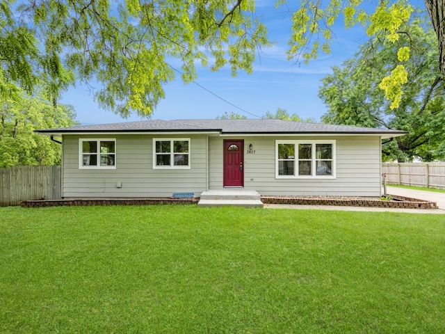 ranch-style home with a front yard