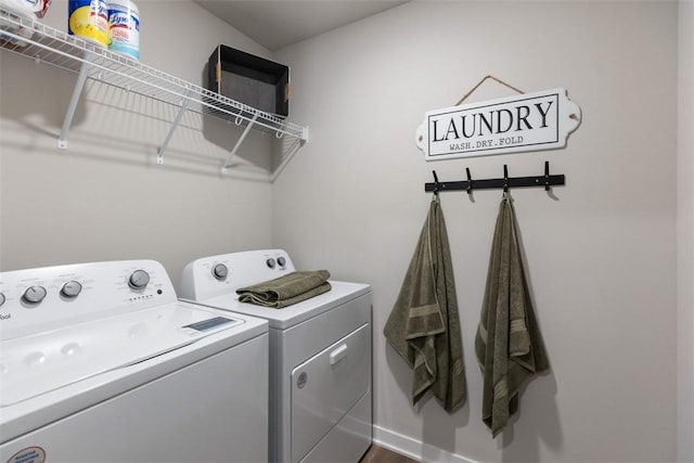 clothes washing area with laundry area and separate washer and dryer