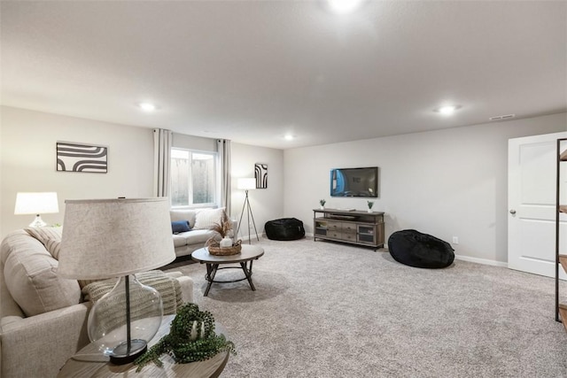 living area featuring carpet floors, recessed lighting, visible vents, and baseboards