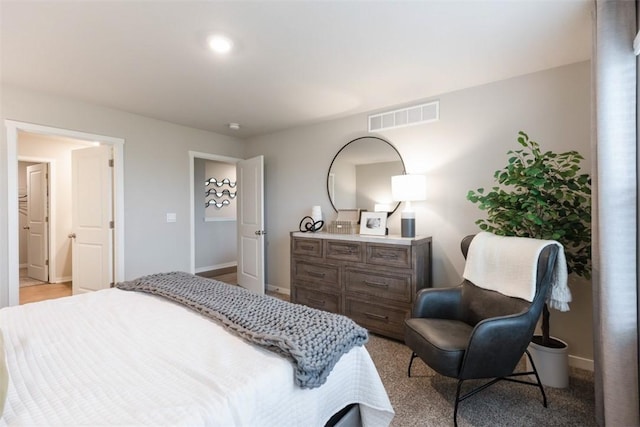 bedroom featuring visible vents and baseboards