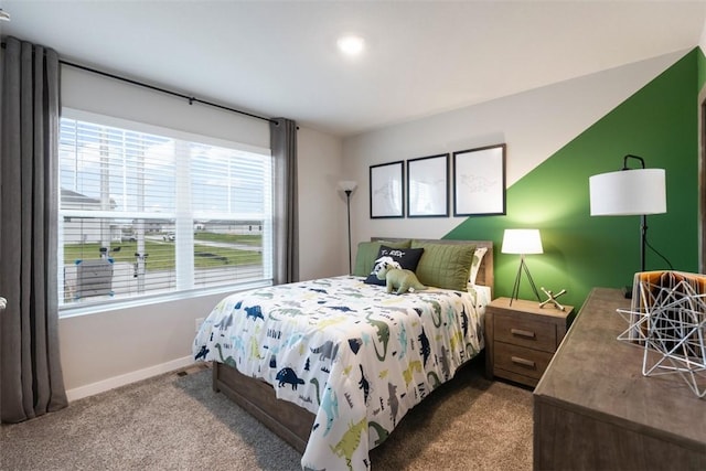 carpeted bedroom featuring baseboards