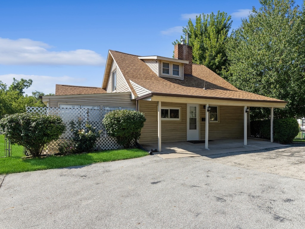 view of front of home with a carport