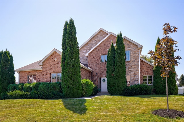 view of property featuring a front lawn