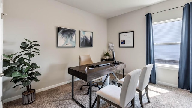 carpeted home office with baseboards