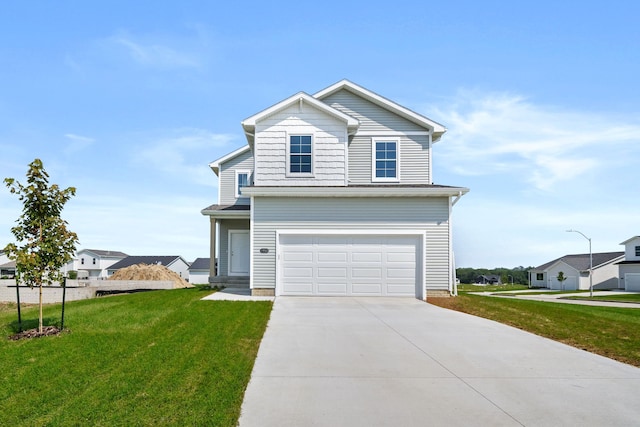 front of property featuring a garage and a front lawn