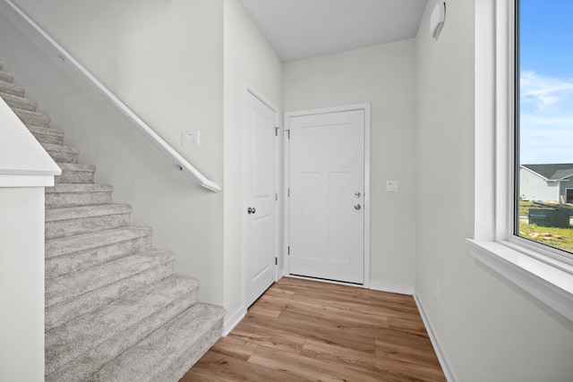 doorway with light hardwood / wood-style flooring