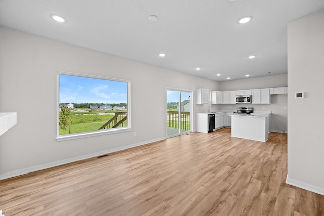 unfurnished living room with light wood-type flooring