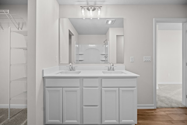 bathroom featuring wood-type flooring and vanity