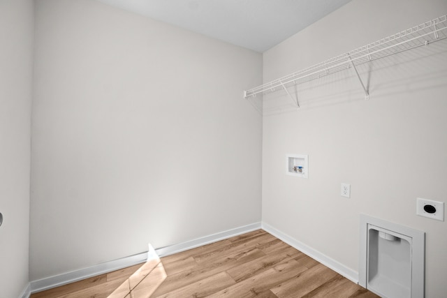 laundry room featuring wood-type flooring, washer hookup, and electric dryer hookup