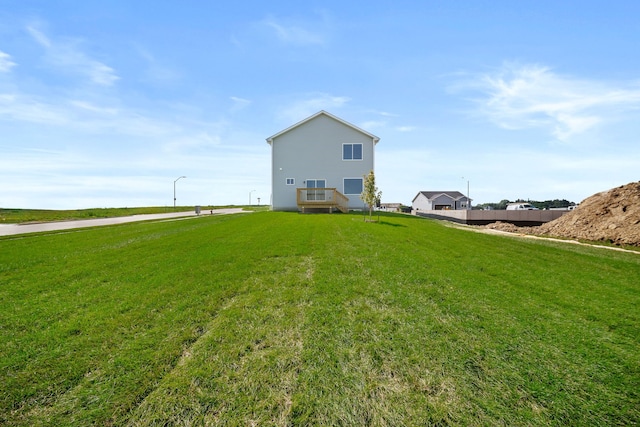 view of side of property featuring a yard