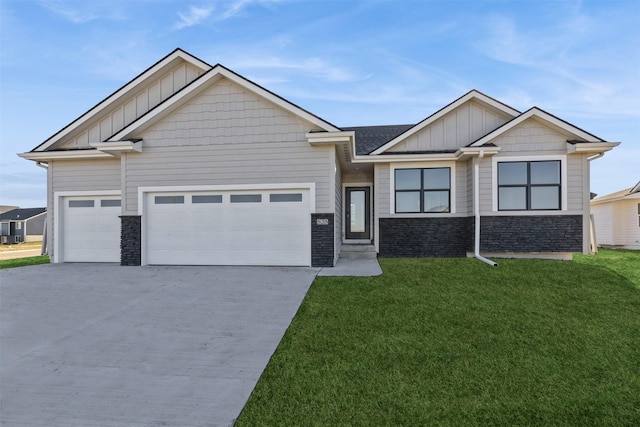 craftsman-style house with a garage and a front lawn