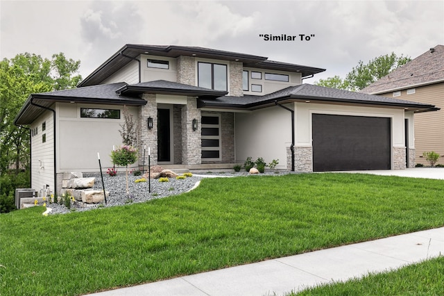 prairie-style home with stucco siding, concrete driveway, a front yard, a garage, and stone siding